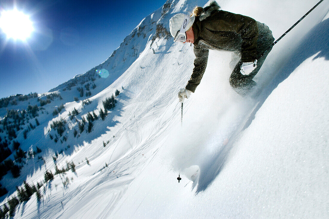 USA, Utah, young woman skiing Lee's Tree, Alta Ski Resort