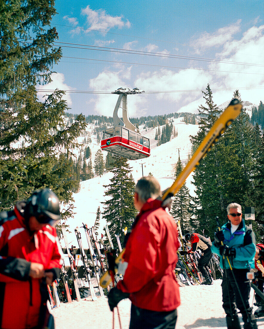 USA, Utah, a man watches the tram at the Snowbird Ski Resort base