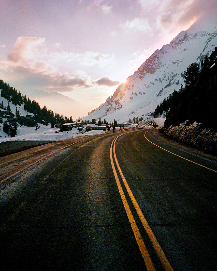 USA, Utah, road with snowcapped Mount Superior in the background, Alta Ski Resort