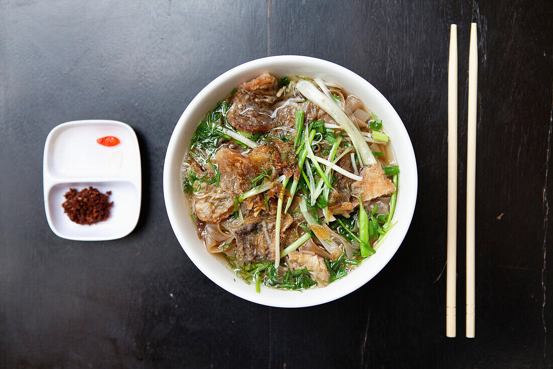 VIETNAM, Hanoi, traditional street food restaurant called Quan An Ngon, Beef Noodle bowl, Banh ota ca