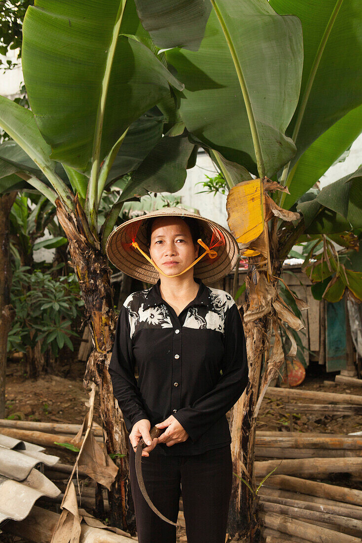 VIETNAM, Hanoi countryside, portrait of rice farmer Nguyen Thi Ha at her home in Nguyen Huu Y village