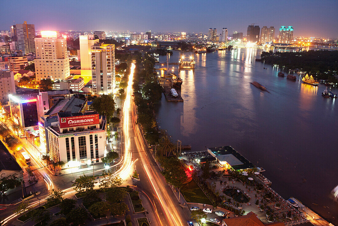 VIETNAM, Saigon, Ho Chi Minh City, an elevated view of the city and the Saigon river at night shot from the top of the Renaissance Riverside Hotel