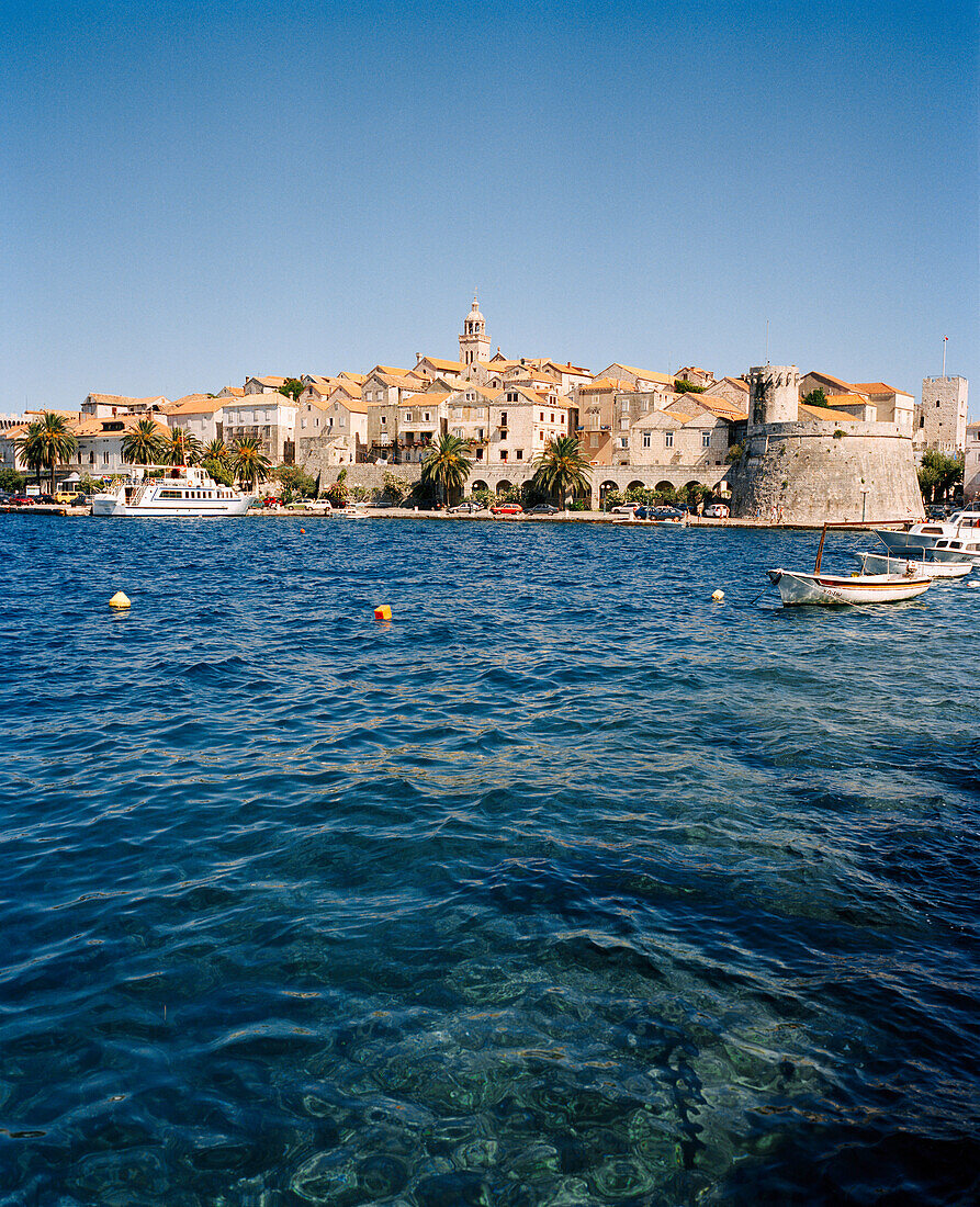 CROATIA, Korcula, Dalmatian Coast, waterfront with buildings in the background in Korcula.