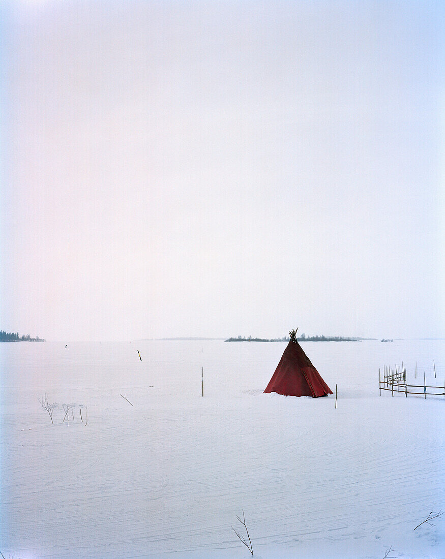 FINLAND, Kemi, Arctic, a teepee on snow-covered landscape