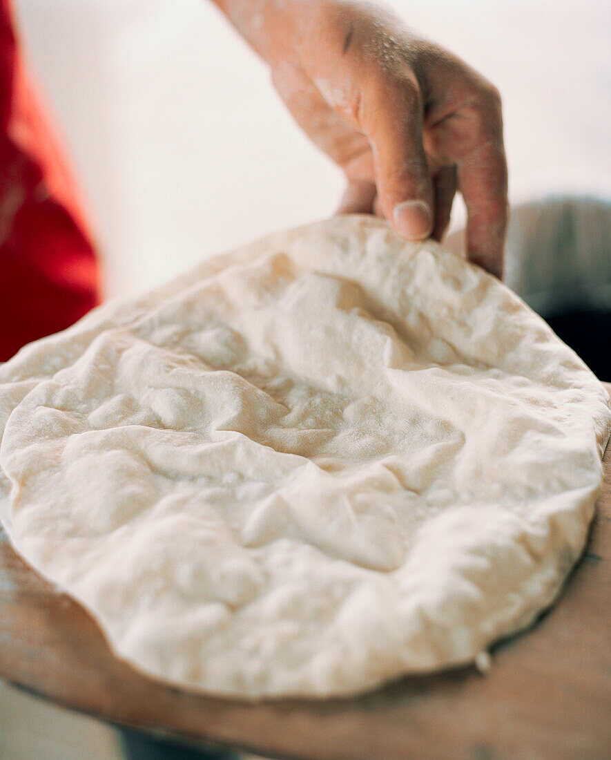 OMAN, Muscat, person holding homemade food, close-up