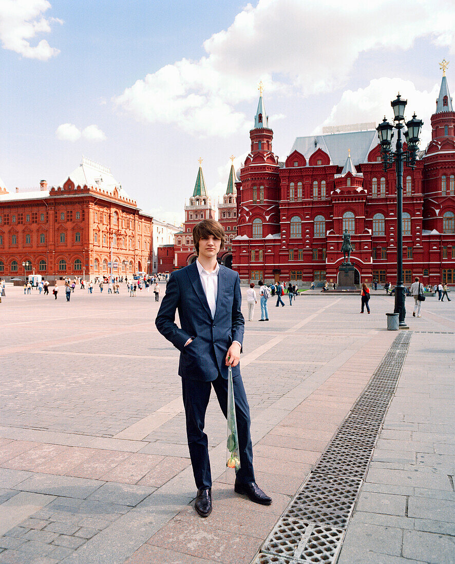 RUSSIA, Moscow, Kremlin, young man posing with people in the background
