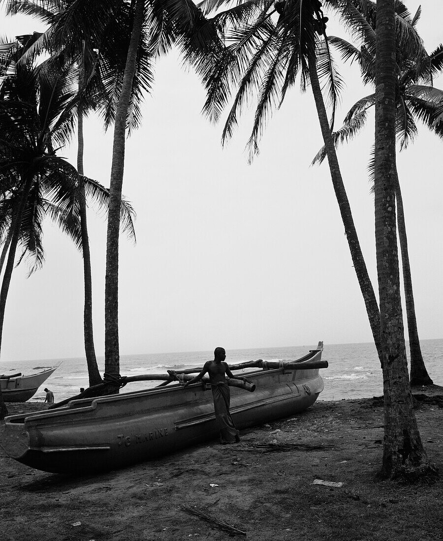 SRI LANKA, Asia, fisherman standing by boat at Galle