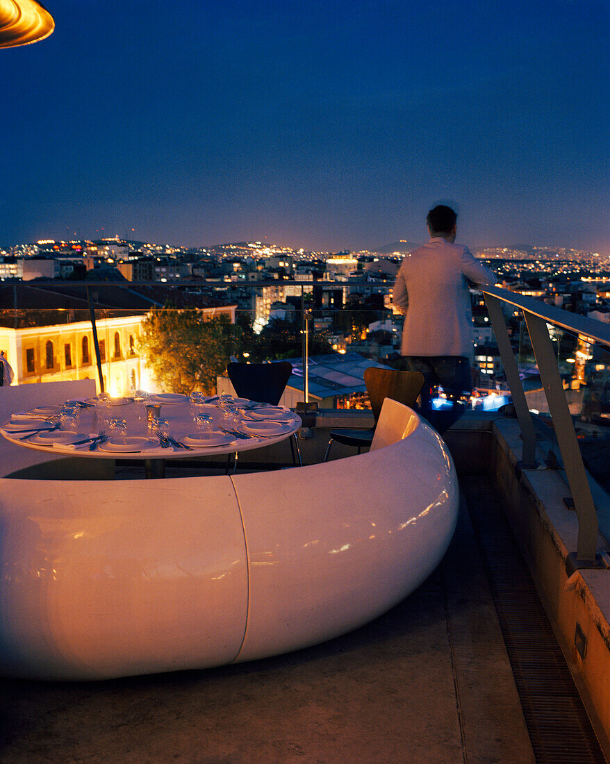 TURKEY, Istanbul, rear view of man standing on roof of 360 Restaurant