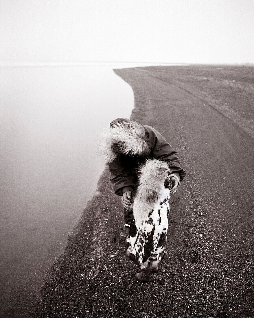 USA, Alaska, Inupiat woman and grandson by waters edge, Point Barrow (B&W)