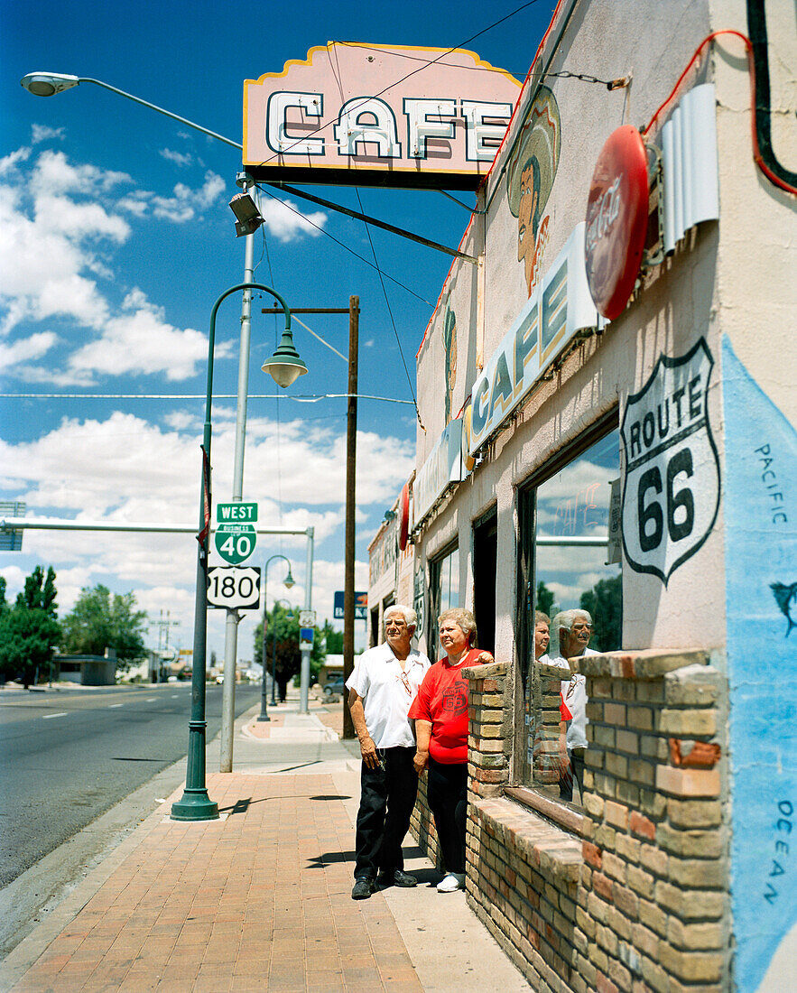 USA, Arizona, Holbrook, senior couple standing at entrance of the Route 66 Cafe