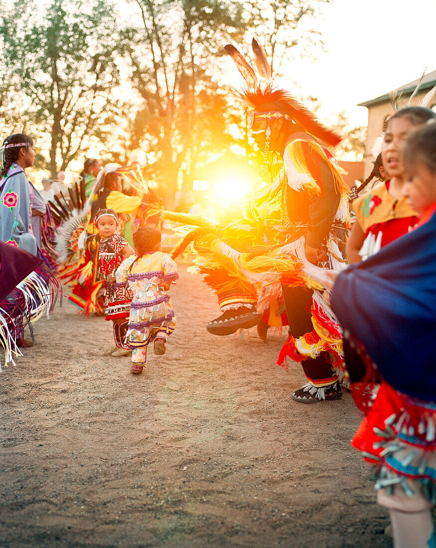 USA, Arizona, Holbrook, group of Navajo Dancers at sunset
