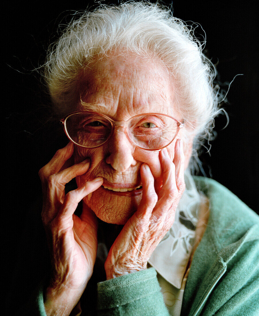 USA, California, portrait of a 103 year old woman on a black background