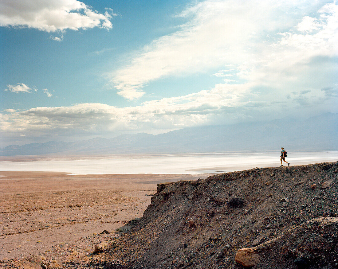 USA, California, Death Valley National Park, person hiking, Badwater Flats in distance
