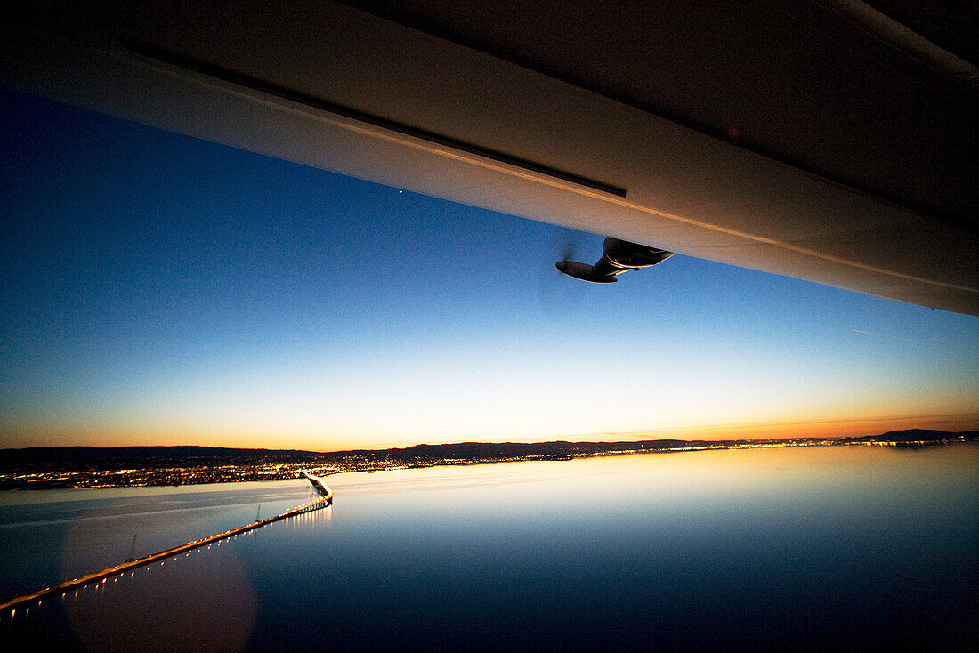 USA, California, San Francisco, flying over San Francisco Bay at night in the Airship Ventures Zepplin, Sam Mateo Bridge