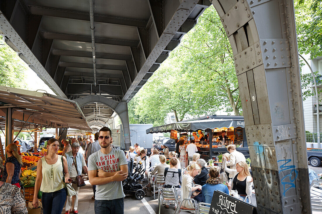 Market stalls below urban railway system, farmers market in Isestrasse, Eppendorf, Hamburg, Germany