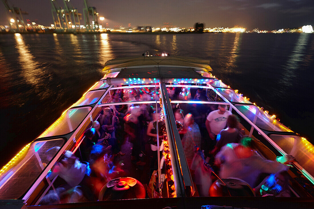 Party barge Frau Hedi, DJs putting on records during the harbour cruise, Hamburg, Germany