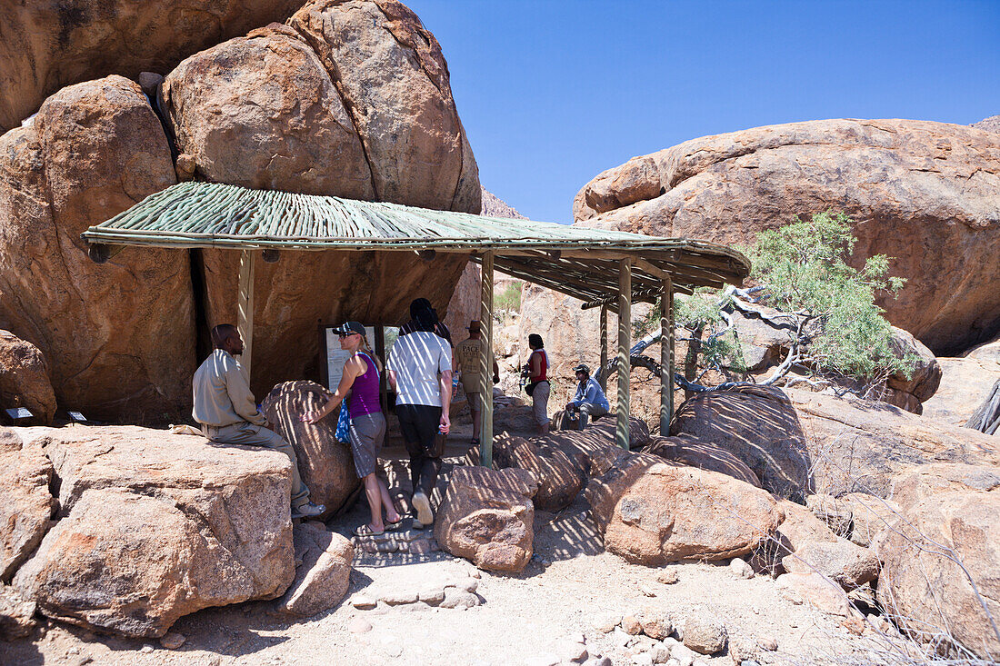 Tourists visiting The White Lady Rock Painting, Brandberg, Erongo, Namibia