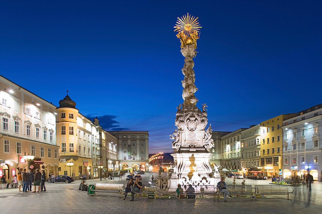 Main square in the evening with the baroque Holy Trinity column, also known as Plague column, Linz, Upper Austria, Austria