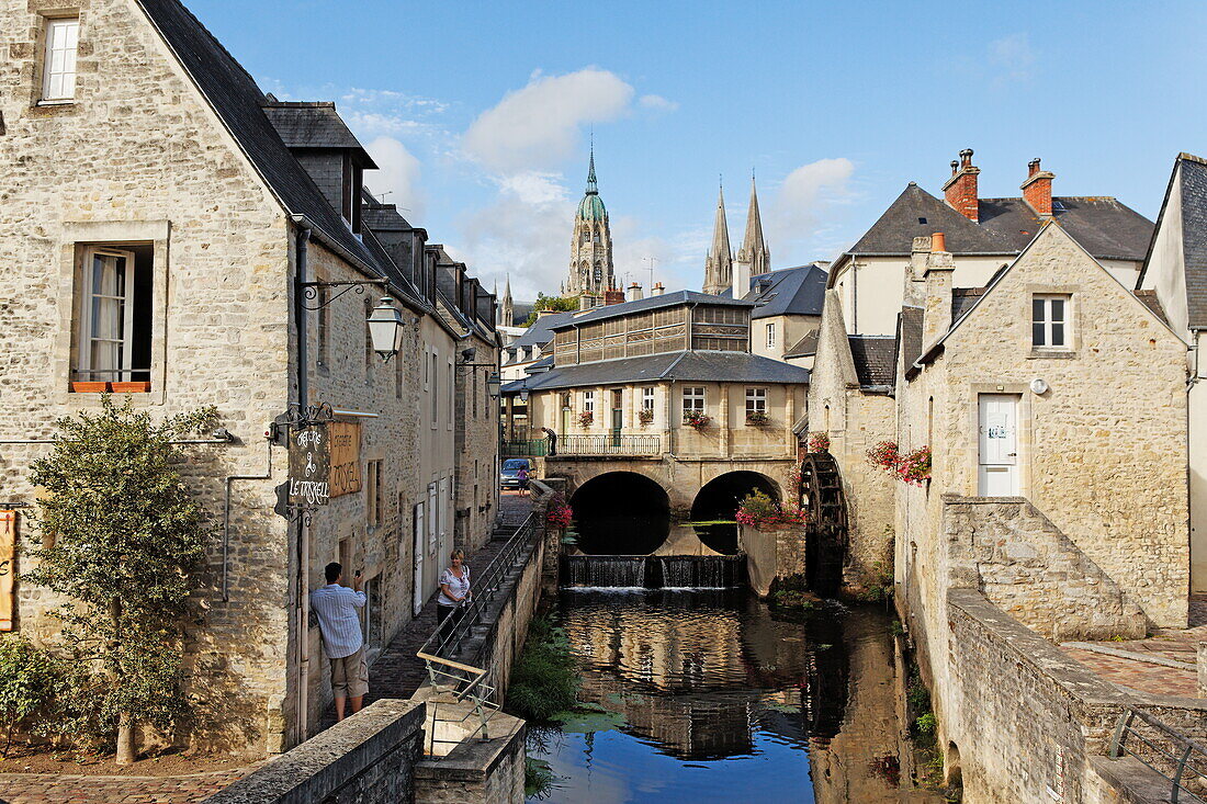 L'Aure, a water mill, the tourist office and the cathedral in Bayeux, Lower Normandy, Normandy, France