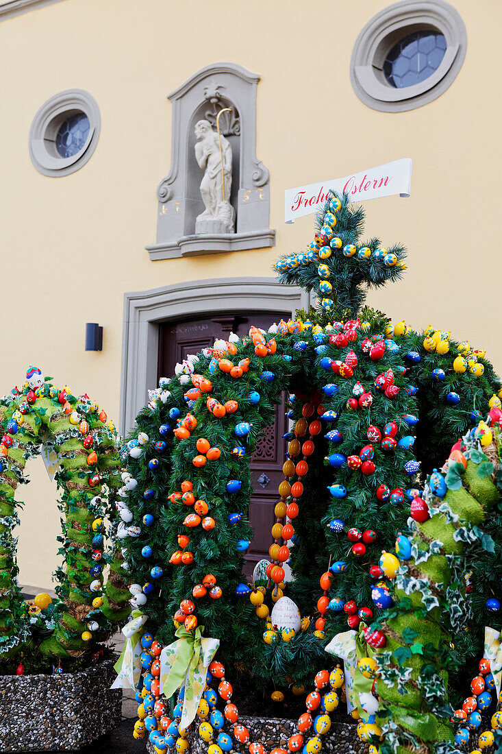 Fountain decorated with Easter eggs in Breitenbach, Lower Franconia, Bavaria, Germany