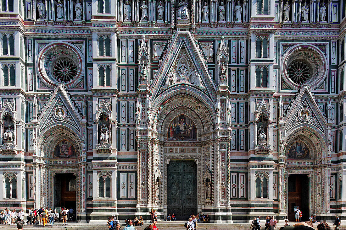 Tourists in front of the facade of the cathedral, Florence, Tuscany, Italy