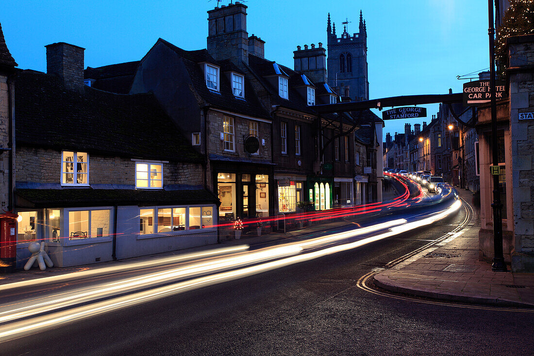 Traffic trails outside the George Hotel in the Georgian market town of Stamford, Lincolnshire, England, UK