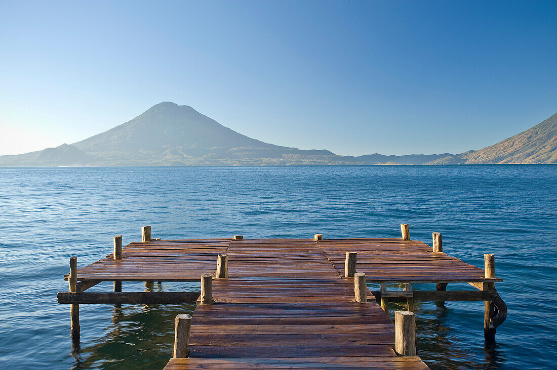 Wooden pier in still lake