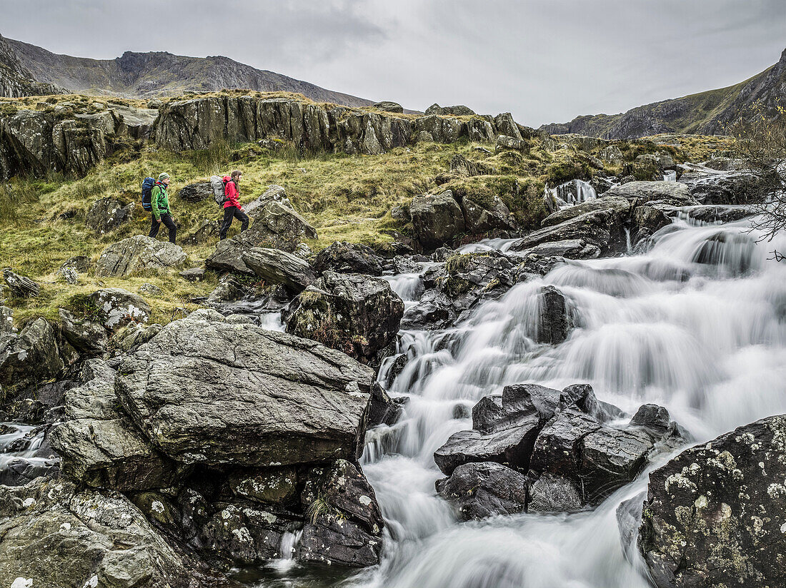 Couple hiking in rocky landscape