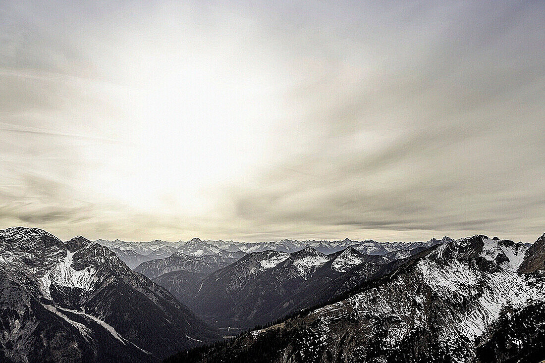 Clouds over mountains in rural landscape