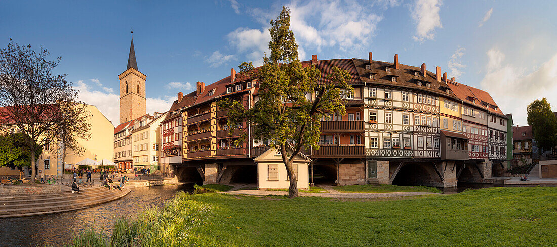 Panorama of the Kraemerbruecke in Erfurt with its half-timbered houses in the last evening light in Spring, Erfurt, Thuringia, Germany