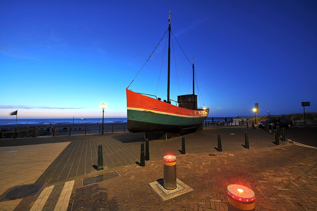 On the beach promenade in the evening, Scheveningen on the North sea coast, Den Haag, The Netherlands
