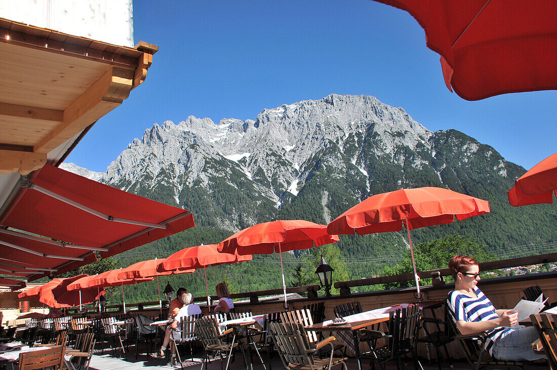 Restaurant near Mittenwald with the Karwendel mountain range in the background, Bavaria, Germany