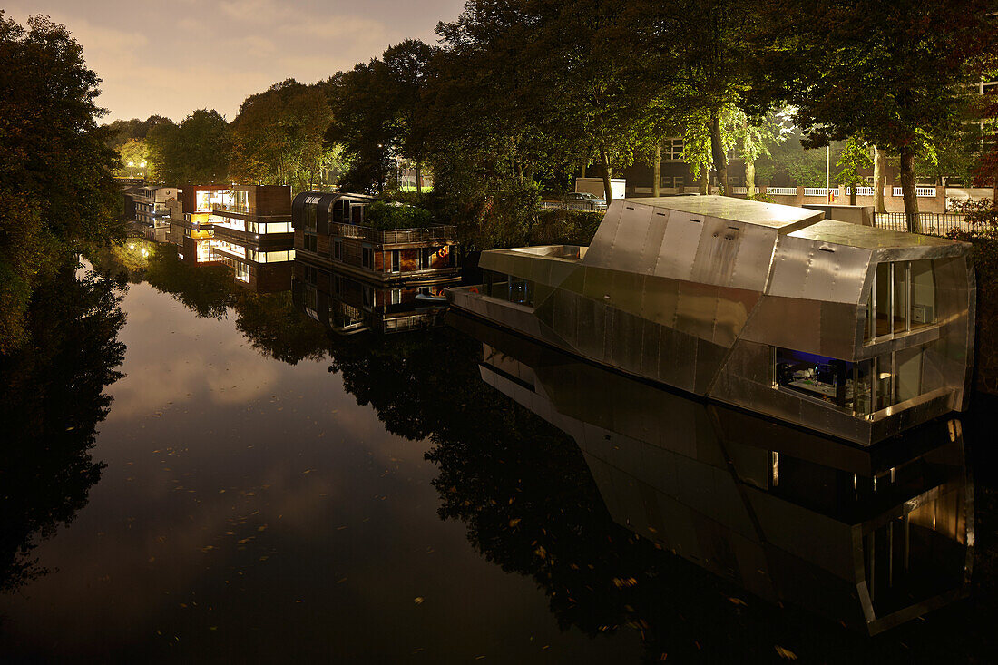 Houseboats on the Eilbek canal at night, Hamburg, Germany