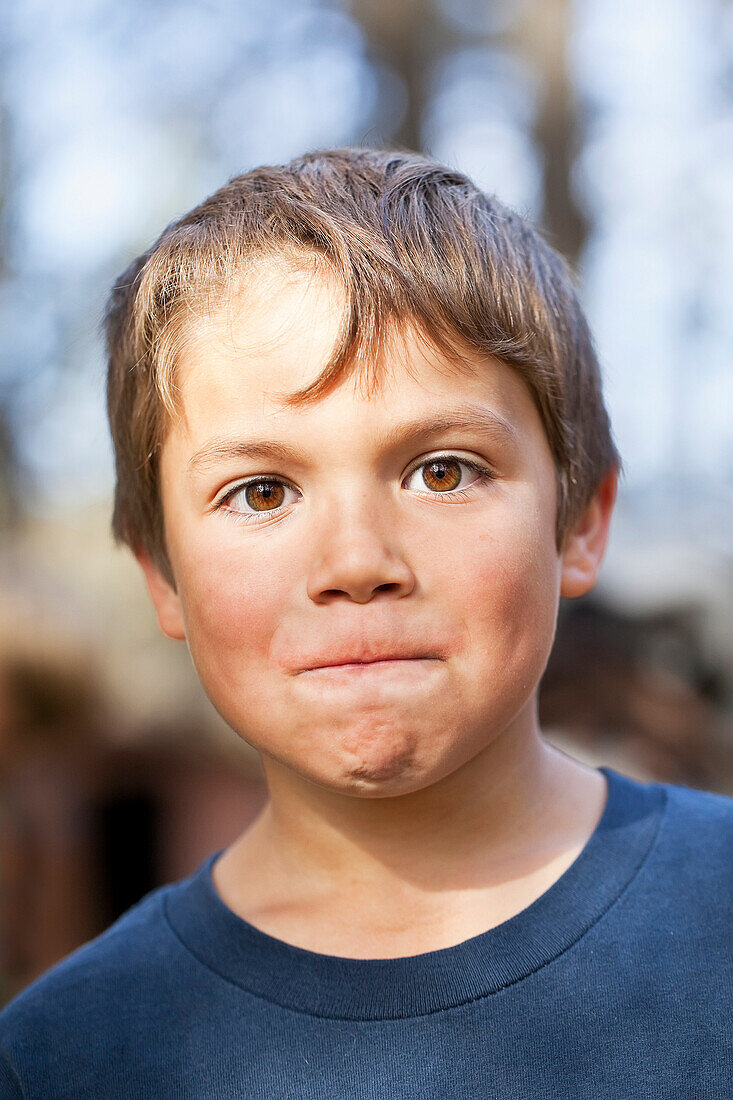 Portrait of young boy making a face, Gimli, Manitoba, Canada