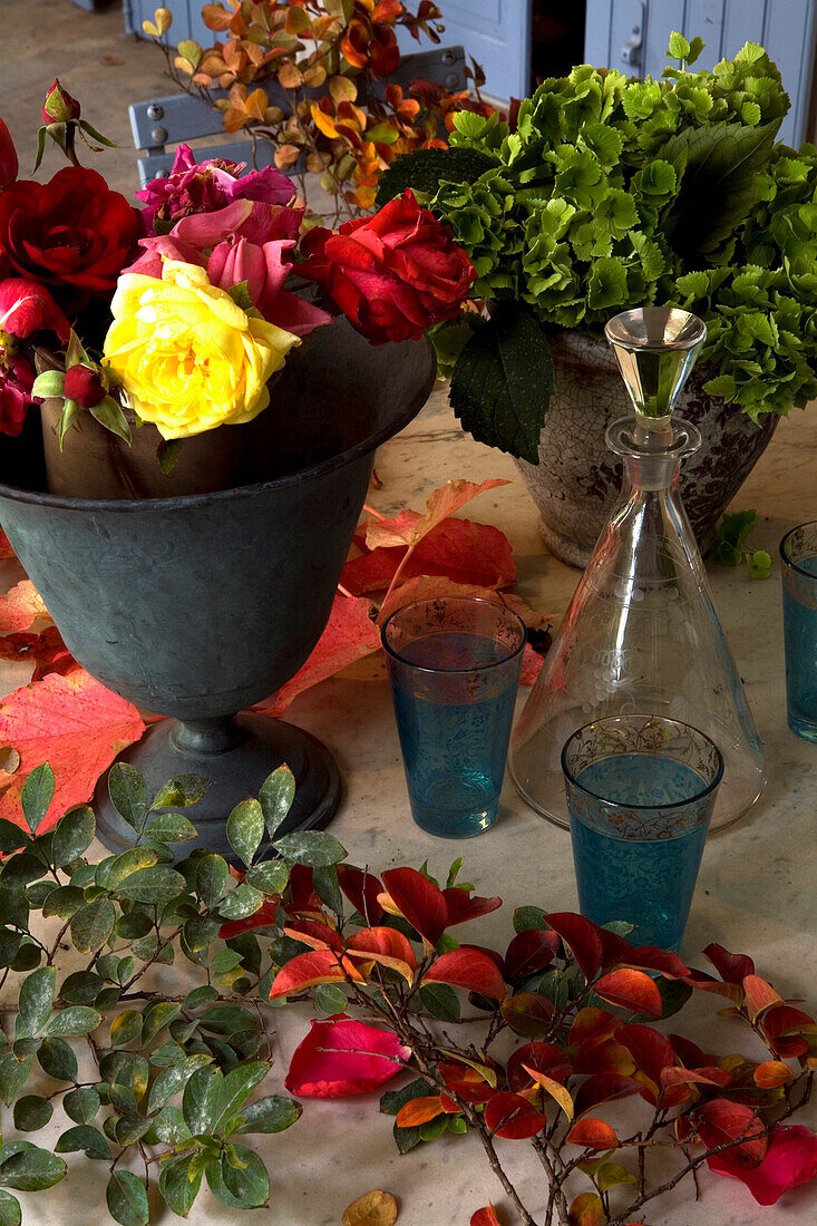 cut flowers in various vases on a table