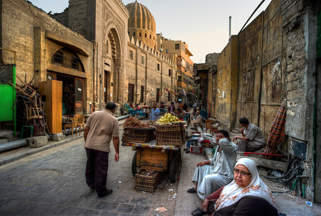 Arab Republic of Egypt, Cairo, trading street, Merchants sitting on the pavement