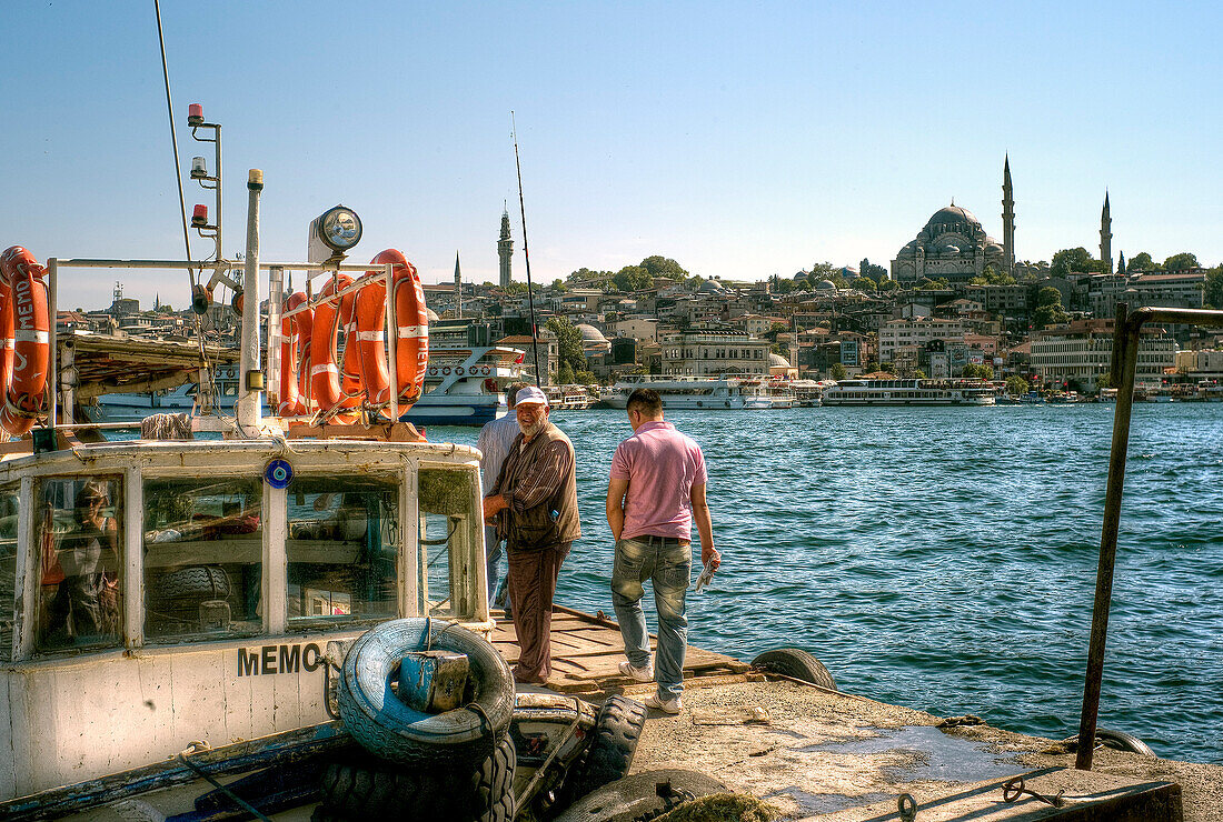 Republic of Turkey, Istanbul, Karaköy District, Fishermen and their boat, The Süleymaniye Mosque
