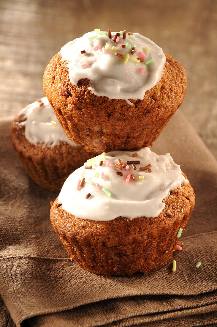 Glazed Lemon Cupcakes on a table napkin