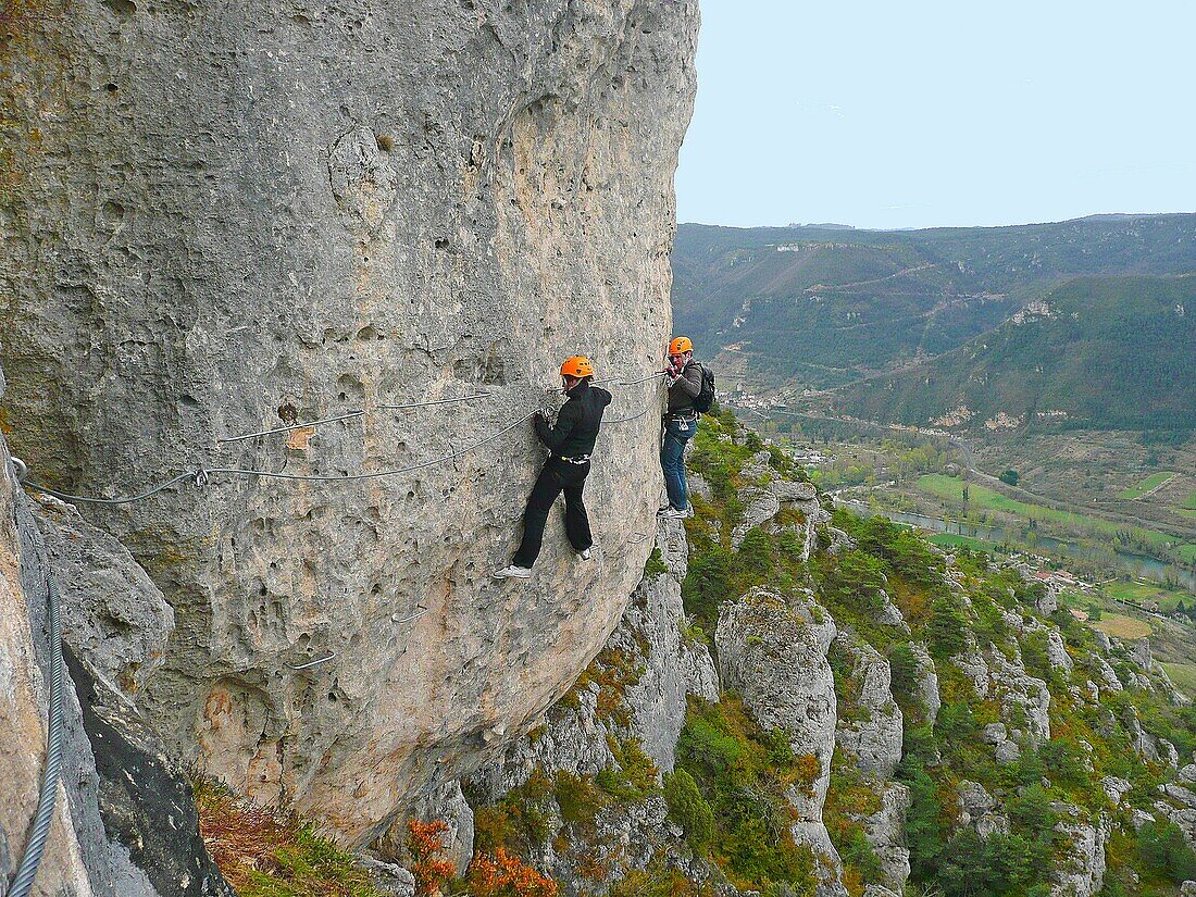 France, Aveyron department, Mostuejouls, Liaucous, men climbing on the Via Ferrata