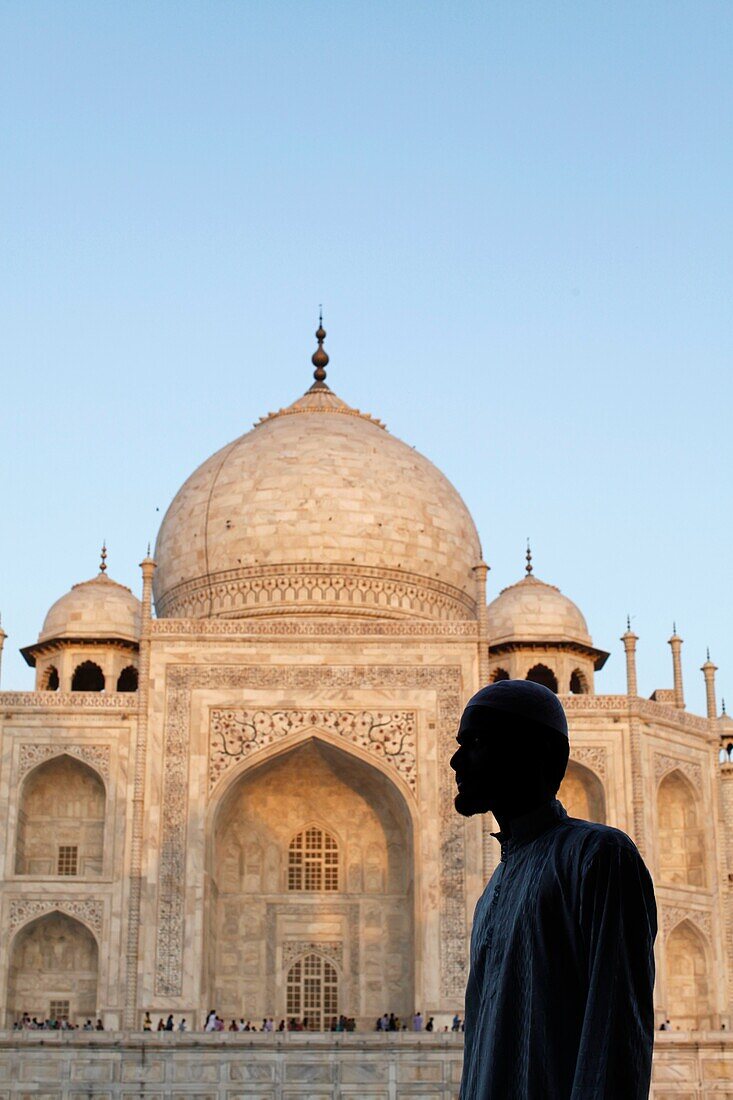 Muslim looking at theTaj Mahal Agra. India.