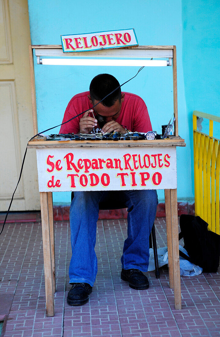 Watchmaker repairing watches in Vinales, Cuba
