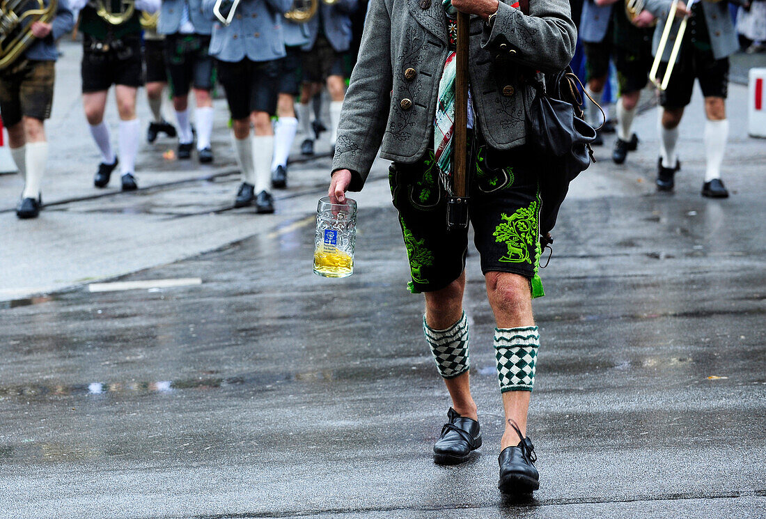 Close-up of music band dressed in traditional leather trousers and socks on Oktoberfest parade in Munich, Germany