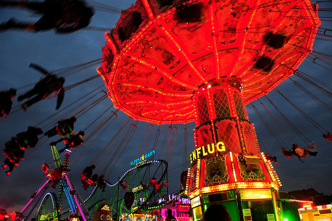 Carousel at  the Oktoberfest in Munich, the world's largest fair, by night, Germany