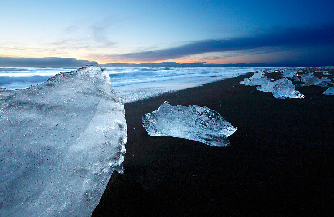 Iceland.  Southeastern Region. Jokulsarlon. Block of ice on the volcanic beach.