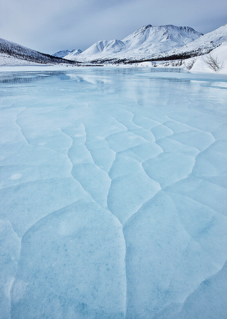Cracked ice on the klondike river in tombstone territorial park, yukon canada
