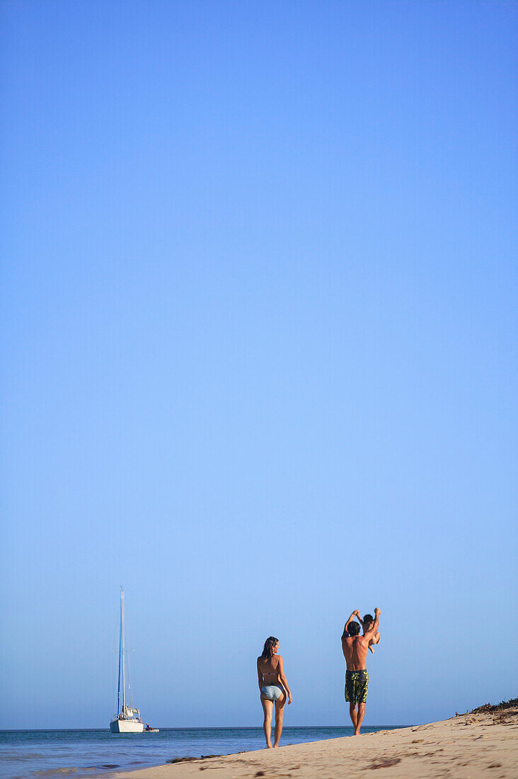 Family walking together on beach