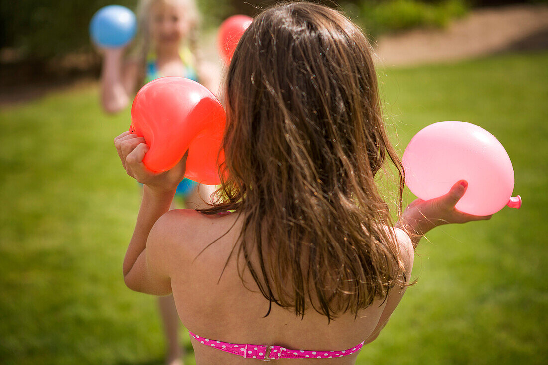 Girls playing with water balloons