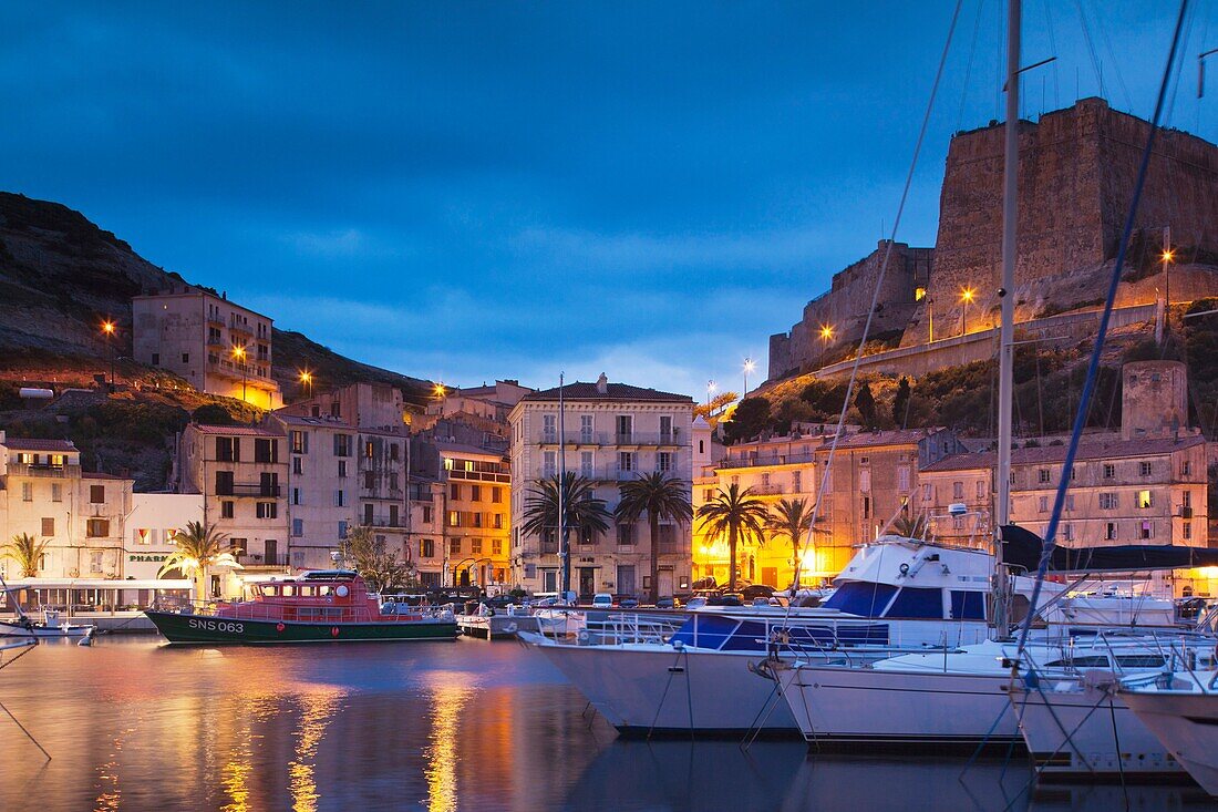 France, Corsica, Corse-du-Sud Department, Corsica South Coast Region, Bonifacio, port and Citadel, dusk