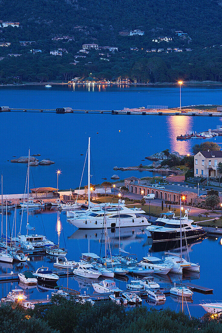France, Corsica, Corse-du-Sud Department, Corsica South Coast Region, Porto Vecchio, elevated view of the marina, dusk