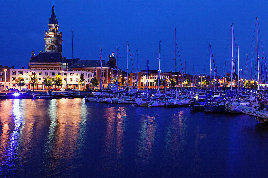 France, Nord-Pas de Calais Region, Nord Department, French Flanders Area, Dunkerque, Bassin du Commerce marina and town hall tower, dusk